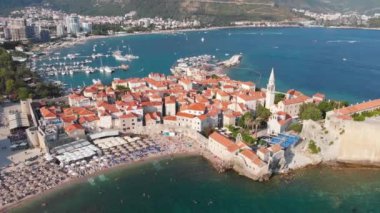 Aerial view of Budva, old and modern city on Adriatic Sea coast. Center of Montenegrin tourism and popular sea resort.