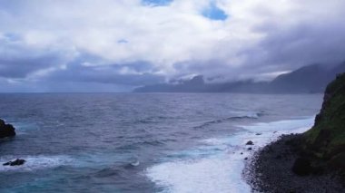 Fırtınalı okyanusta volkanik kayalar. Ribeira da Janela in Madeira, Portugal by Drone