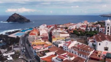 Aerial morning view of Garachico city center with colored houses. Old town of Garachico on island of Tenerife, Canary. Ocean shore and lava pools. Popular tourist destination, pearl of the Canary