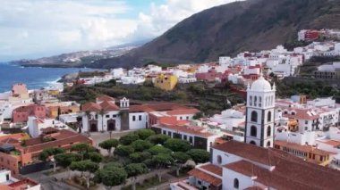 Aerial morning view of Garachico city center with colored houses. Old town of Garachico on island of Tenerife, Canary. Ocean shore and lava pools. Popular tourist destination, pearl of the Canary