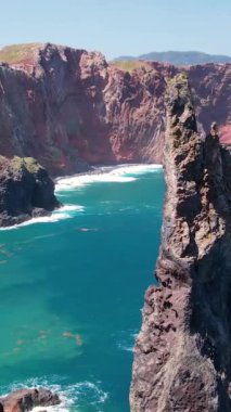 Fırtınalı okyanusta volkanik kayalar. Ribeira da Janela in Madeira, Portugal by Drone