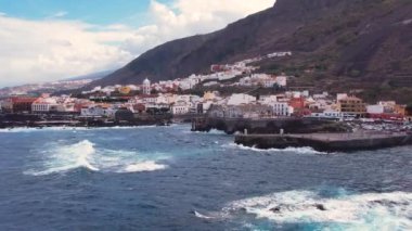 Aerial morning view of Garachico city center with colored houses. Old town of Garachico on island of Tenerife, Canary. Ocean shore and lava pools. Popular tourist destination, pearl of the Canary