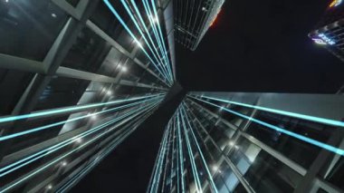 Gece gökyüzünün önündeki iş binalarının teknoloji efektli alt görüntüsü
