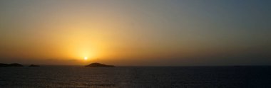 orange sunset in mediterranean sea, sea panorama for natural horizontal background.