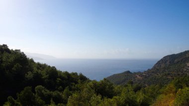 seascape, view of the mediterranean sea from the height of the forested mountains.