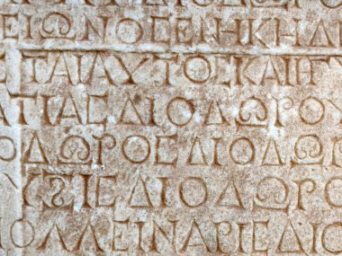 ancient Greek writing on the stone walls of the ancient city of Hierapolis close-up