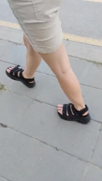 Legs Girl Black Sandals Walk Sidewalk Side View — Stock Video