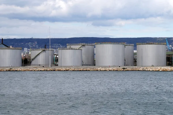 large round storage tanks in the cargo sea port of Varna Bulgaria.