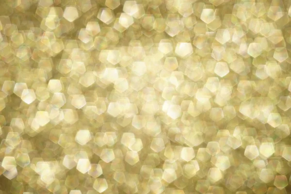 Błyszczące Niewyraźne Złote Tło Pięciokątnymi Bąbelkami — Zdjęcie stockowe