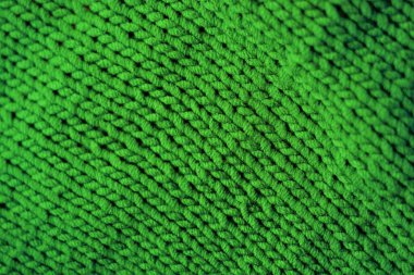 Örülmüş yeşil arka plan, gri süveter şablonu.