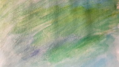 Pastel abstract background with blue green watercolor paints.