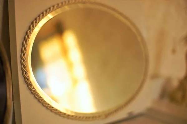 Oval mirror with a beautiful gold edging, dressing table decor, console mirror