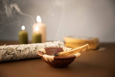 Palo santo stick with white sage and tarot deck clipart