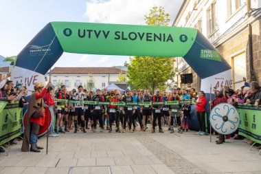 Ajdovscina, Slovenia, April 26th 2024: People waiting for the start of Emperor runners of Ultra Trail Vipava Valley that takes place every year in April in Vipava Valley, Slovenia clipart