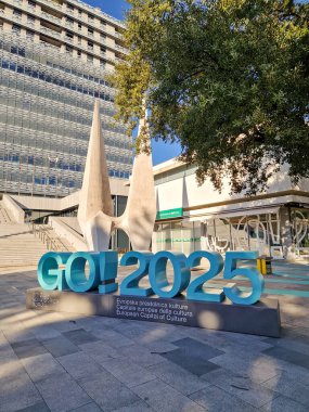 Nova Gorica, Slovenia - January 14th 2025: Logo sculpture GO! 2025 for European Capital of Culture 2025  ready for opening clipart