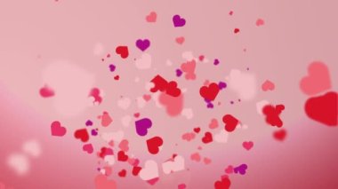Freely falling down colored figures of hearts. Animated abstract pink background. Looped video. Concept for valentine's day, wedding.