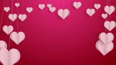 Pink paper hearts on strings sway in the wind. Love romantic red background. Frame with empty space for text.
