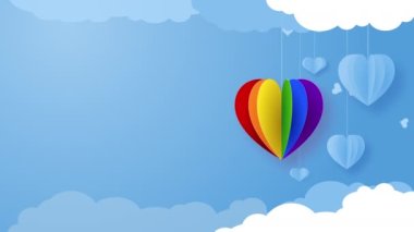 Heart shape in rainbow colors as symbol of LGBT community on blue background with empty space for text. Romantic love animation.