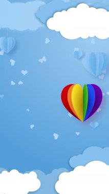 Mavi zemin üzerinde LGBT topluluğunun sembolü olarak gökkuşağı renginde kalp şekli ve metin için boş alan. Romantik aşk animasyonu. Dikey video.