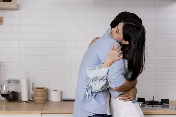 Romantic lover embracing in kitchen, Young handsome man making proposal give a ring to surprise his girlfriend for ask her to marry at home, They will marry together