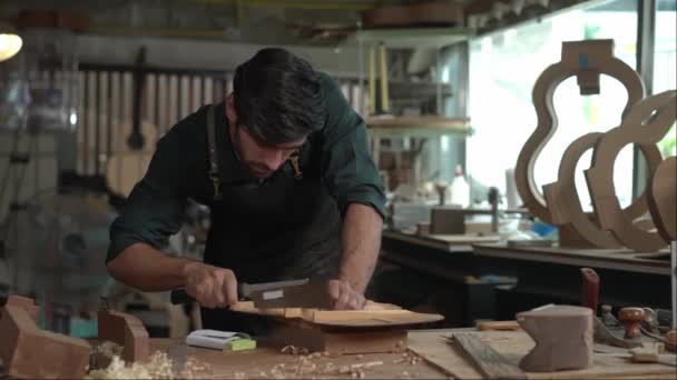 Skilled Luthier Hard Work Sanding Body Acoustic Guitar His Workshop — Stock Video