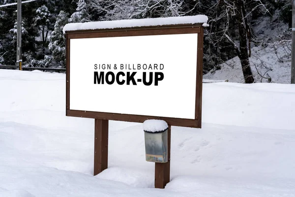 This snow-covered sign & billboard mockup is the perfect way to create professional-looking visuals for your winter marketing materials.