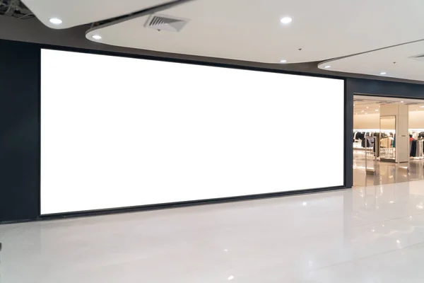 Mockup of a blank store front billboard in a shopping mall. Perfect for showcasing your logo and branding.