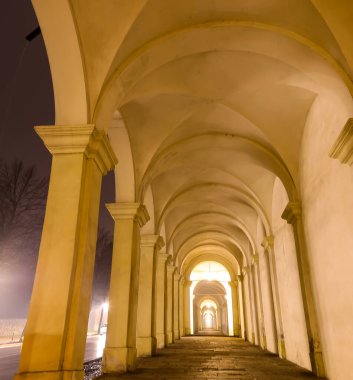 night view of the gallery of architectural arches of the City of VICENZA in Northern Italy that seem to never end