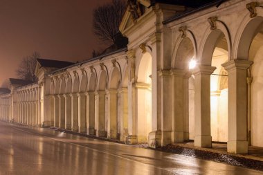 night view of the gallery of architectural arches of the city of VICENZA in Italy during the thunderstorm