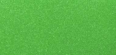 GREEN shimmering glitter material background with glowing effects