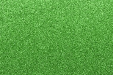 deep light green glitter background with reflective glitter material