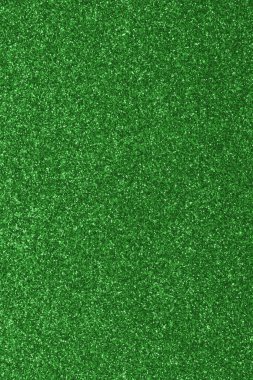 GREEN shimmering glitter material background with glowing effects