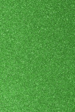 GREEN shimmering glitter material background with glowing effects