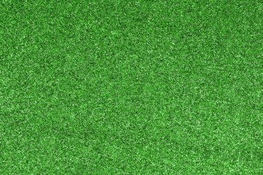 GREEN shimmering glitter material background with glowing effects and light reflections