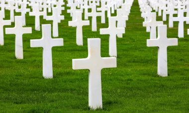 Colleville-sur-Mer, FRA, France - August 21, 2022: American Military Cemetery and many crosses on the graves of the soldiers