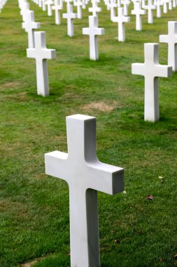 Colleville-sur-Mer, FRA, France - August 21, 2022: American Military Cemetery and many crosses on the graves of the soldiers