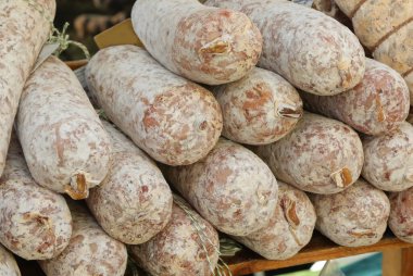 cured meats and pork sausages made by the farmer for sale in the local market