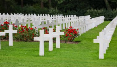 Colleville-sur-Mer, FRA, France - August 21, 2022: American Military Cemetery and many crosses on the graves of the soldiers