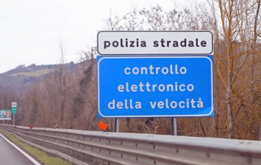 Siena, SI, Italy - February 21, 2023: Italy Warning Panel that means Police electronic speed control in the highway clipart