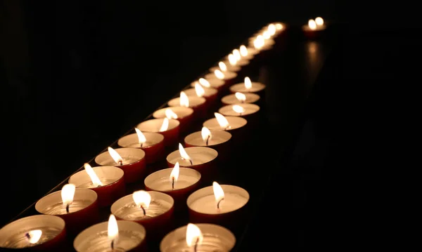 Votive Candles Flame Lit Mass Faithful Church — Stockfoto