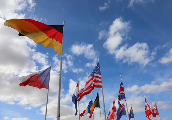 international flags during a meeting and blue sky without people