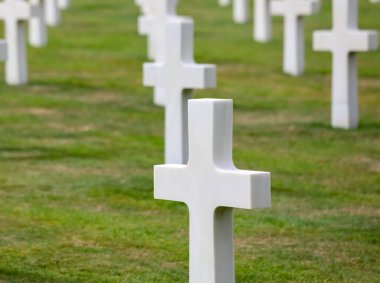 Colleville-sur-Mer, FRA, France - August 21, 2022: American Military Cemetery and many crosses on the graves of the soldiers
