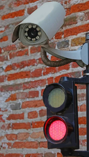 modern camera with red traffic light for automatic access control in the restricted area