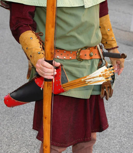archer hunting with leather quiver for arrows and medieval clothes during historical reenactment