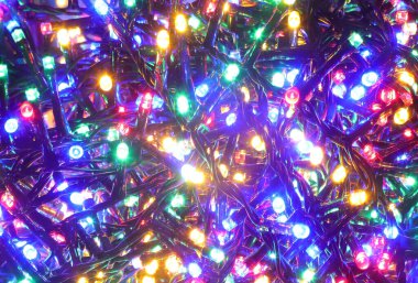 Bayramlarda süslemeler için aydınlatılmış LED ışıkları serisinin arka planı, özellikle kutlamalar için bir arka plan olarak Noel idealinde