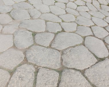 İtalya 'daki çok eski bir ROMAN yolunun taşlarının arka planı