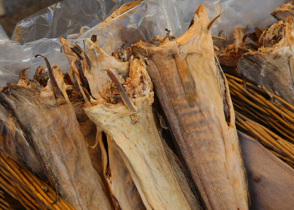 Headless dried stockfish a highly prized delicacy on sale at the fish market