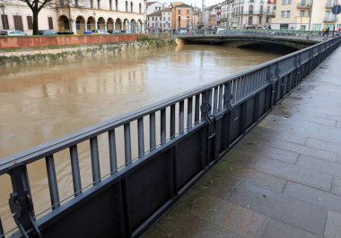 metallic bulkheads to protect Vicenza City in northern Italy during the flood in winter clipart
