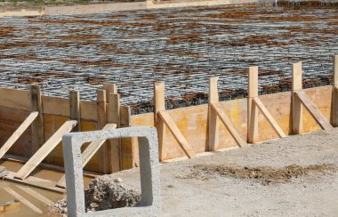 Reinforced concrete slab foundation construction on site without workers clipart