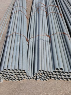 many iron pipes to be laid inside the construction site to then pass the fluids of the Infrastructure network clipart